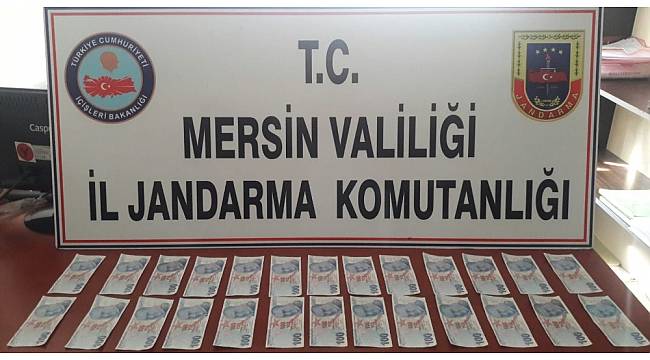 Mersin'de sahte parayla esnafı dolandıran kadın yakalandı